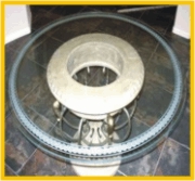Rope border is carved into classical round table top